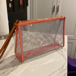 COACH pink leather and clear plastic wristlet